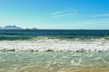 Rio de Janeiro, Brazil, May 19, 2025: Copacabana Beach is a beach located in the Copacabana neighbourhood, in the South Zone of the city of Rio de Janeiro, Brazil. Beautiful blue skies and golden sand