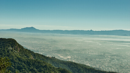 Rio de Janeiro, Brazil - May 20, 2025: View to the lagoon from Christ the Redeemer statue in Corcovado Mountain, Rio. de Janeiro, Brazil. With beautiful blue skies during winter. 