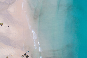 A serene and beautiful wallpaper of a sandy shore and turquoise water tranquility concept