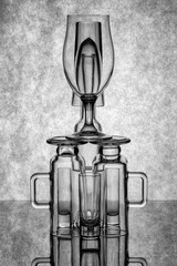 Still life with glassware on a reflective surface
