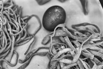 Traditional Italian uncooked egg pasta laid out for drying or further preparation