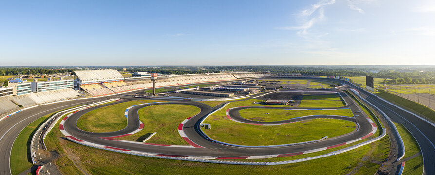 Concord, United States - 28 July 2025: Aerial view of Charlotte Motor Speedway, where the vibrant green infield contrasts sharply with the gray asphalt tracks.
