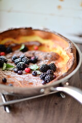 Dutch Baby Dessert with Fresh Fruit, Sugar, and Mint