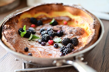 Dutch Baby Dessert with Fresh Fruit, Sugar, and Mint