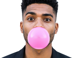 A young man blowing a large pink bubblegum bubble, displaying a playful expression with wide eyes.