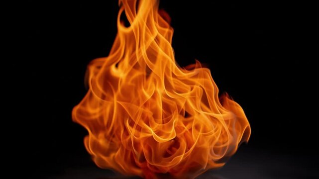 Fiery flames dance against a black backdrop showcasing fluid orange and yellow tongues