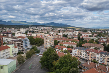 Drone view of residential building in Kazanlak town, Bulgaria, view with Balkan mountains on background