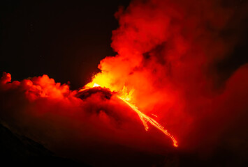 eruption of volcano during night ,  Night sky fire explosion burst flame smoke burning light glow...