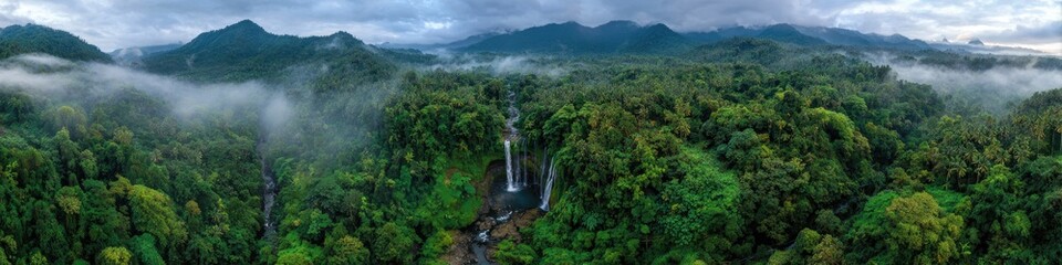 Aerial View of Sekumpul Waterfall Amidst Lush Indonesian Rainforest at Dawn