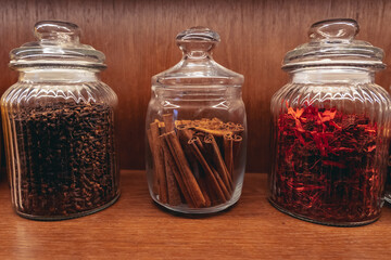 A glass jar with cinnamon quills in the kitchen