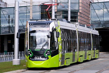 The Modern Green Tram operates at Urban Station, showcasing efficiency and sustainability
