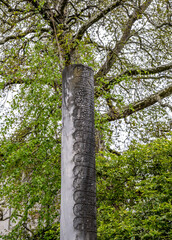 Fototapeta premium An ancient stone pillar with Arabic script and inscriptions.