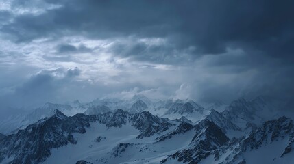 A breathtaking view of snow-capped mountains under a dramatic, cloudy sky, evoking a sense of serenity and grandeur in nature.