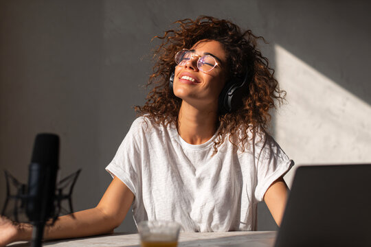 A female content creator works in her home office creating content for social media. digital lifestyle