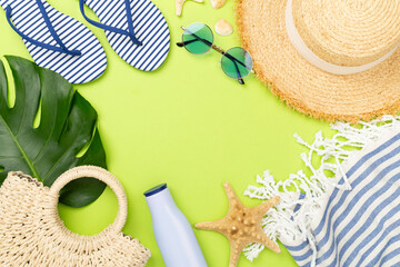 Blue beach accessories on color background, top view. Copy space for text