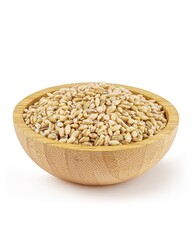Wooden bowl of pearl barley on white.