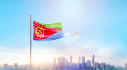 Eritrea national flag waving with skyline and buildings. Eritrea national flag for independence day.