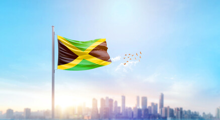 Jamaica national flag waving with skyline and buildings. Jamaica national flag for independence day.