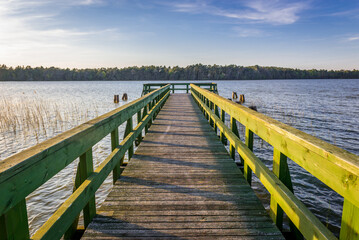 Tourist pier at Dolgie Wielke Lake near Baltic Sea coast in Slowinski National Park, Poland