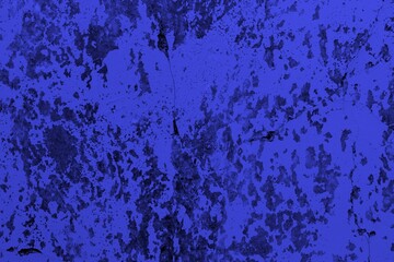 Close-up view of a blue textured wall showing rough patterns and intricate shadow details, offering a visually appealing background texture for versatile creative uses.