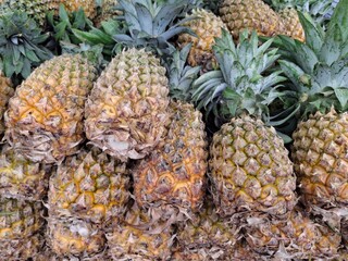 Ripe Pineapples Stacked Together for Sale – Exotic Fruit Display, Farm Harvest, Vibrant Colors,...