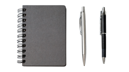 Black spiral notebook with two pens on a white isolate background.