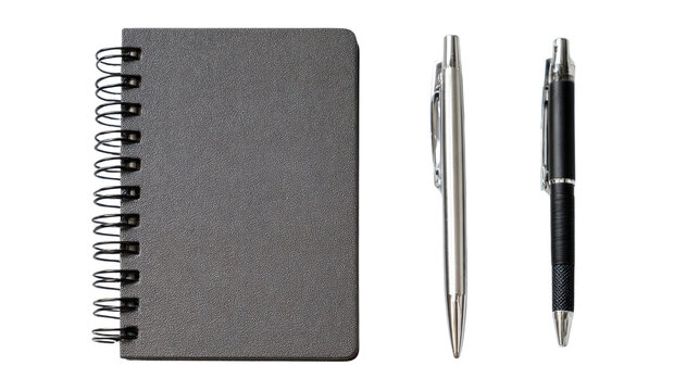 Black spiral notebook with two pens on a white isolate background.