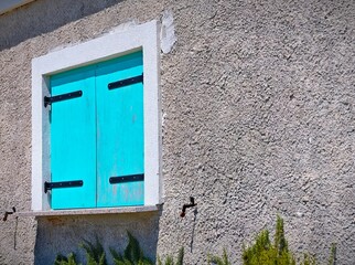 old window with green shutters