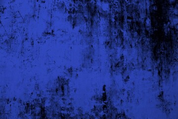 Close-up view of a blue textured wall showing rough patterns and intricate shadow details, offering...