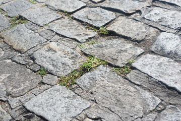 Texture of a street pavement with square and rectangular stones. Geometric pattern. Background. Abstract. Copy space.