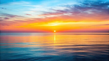 Fototapeta premium Sunset over calm ocean water, vibrant sky with clouds, serene landscape