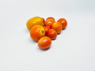 Pile of fresh, ripe tomatoes on a clean white background. Perfect for culinary and food-related projects. Healthy ingredients and vibrant colors. Ideal for food blogs.