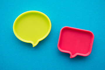 Chat bubbles on social media communication. Green and red chat bubbles icon messages on blue background minimal style. Social media online, social network concept.