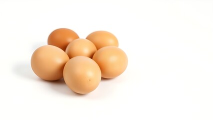 Fresh brown eggs arranged neatly on a pristine white surface, highlighting natural textures.