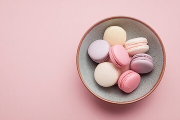 Fototapeta premium Pastel macarons in a bowl top view delicious french macarons dessert sweet treats bakery confectionery shop