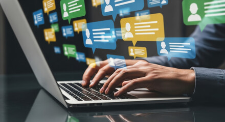 Close-up of hands typing on a laptop with a digital overlay of speech bubbles and user icons representing online communication and social networking
