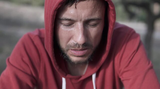 Portrait of a sweaty man after running. The guy does sports to get rid of depression and alcohol addiction.	