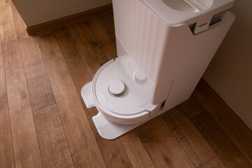 Robot vacuum in action first removes debris then follows with wet mopping to leave the floor clean...