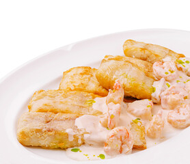 Delicious seafood dish with shrimp and fried plantains served on a white plate