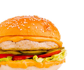 Juicy burger with fresh vegetables and cheese on a sesame seed bun