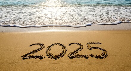 Year 2025 Written in Sand on Tropical Beach with Ocean Waves Approaching, Concept for New Year