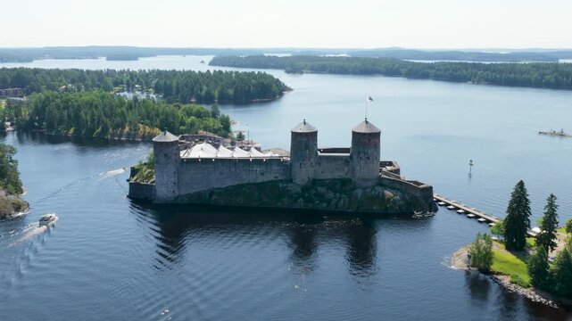 Panoramic drone shot circling the St. Olaf's Castle, in sunny Savonia, Finland