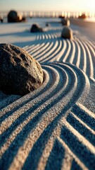 Serene beach scene with gentle waves and rounded stones creating rhythmic patterns in the sand.