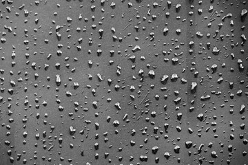 Grey rainy day. Drops of rain on the glass. Background