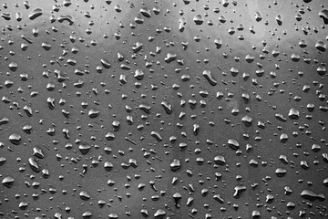 Grey rainy day. Drops of rain on the glass. Background