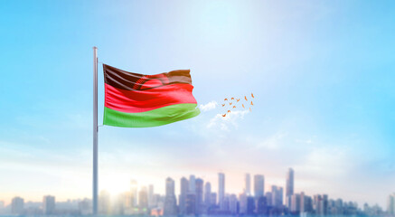 Malawi national flag waving with skyline and buildings. Malawi national flag for independence day.