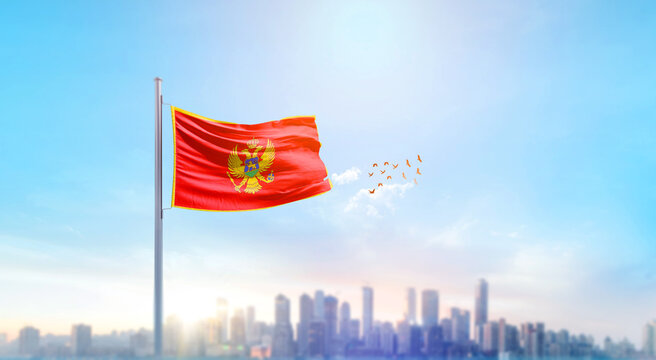 Montenegro national flag waving with skyline and buildings. Montenegro national flag for independence day.