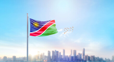 Namibia national flag waving with skyline and buildings. Namibia national flag for independence day.