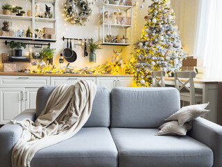 Stylish kitchen with festive decor and Christmas garland. Interior design