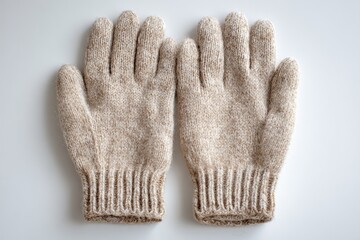 Pair of knitted gloves laying flat on a white surface, ready to wear.